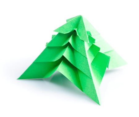 Green origami fir tree or Christmas tree isolated on whiteの写真素材