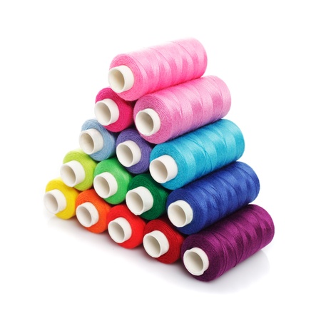 Sewing multicolored  threads isolated on white