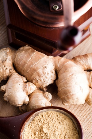 Ginger root and spice closeup on wooden tableの写真素材