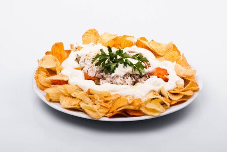 Salad with chiken, vegetables and potato chipsの写真素材