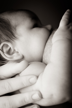 Mother breast feeding her baby close upの写真素材