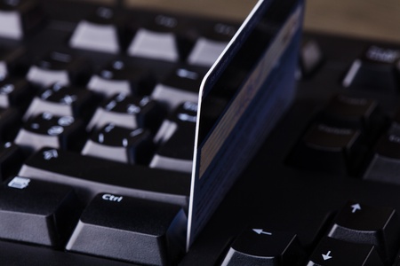 E-commerce, shopping on the internet, different credit cards on the keyboardの写真素材