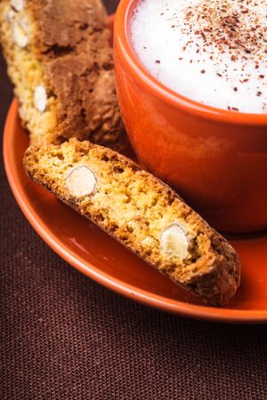 Cantuccini - typical almond cookies with cappuccino cupの写真素材