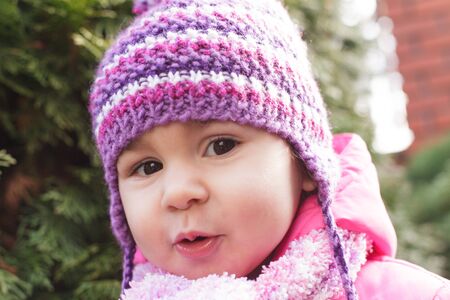 Girl's face with cute smile closeup, outdoors