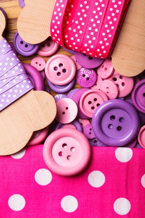 Pink polka dot ribbon, textil and buttons for sewingの写真素材