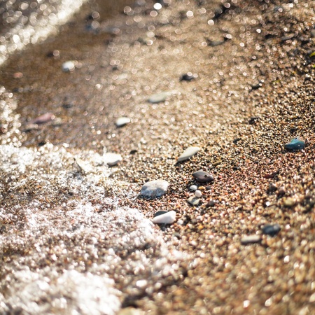 Adriatic sea pebble shore, as an abstract background for design. Vocation concept. Shallow deep of fieldの写真素材