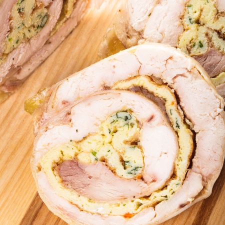 chicken roll with omelette on the wooden boardの写真素材