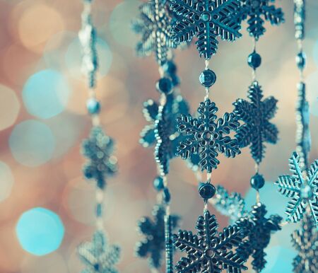Blue snowflakes on the lashing over bokeh background
