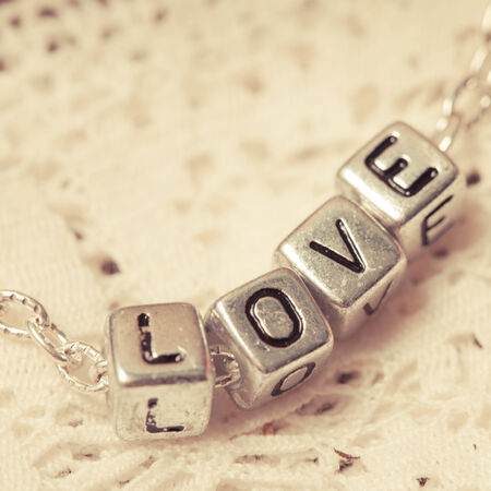 love letters on the chain close up on laceの写真素材