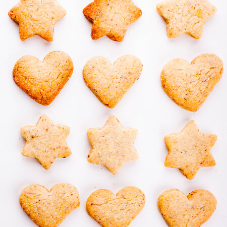 Holiday cookies as a background pattern on whiteの写真素材