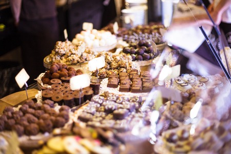 Chocolate candies on showcase in the storeの写真素材