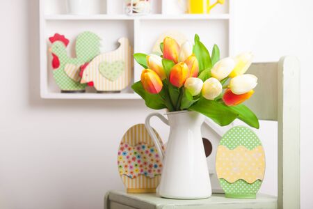 House shelves on a wall - Easter decorations for holiday