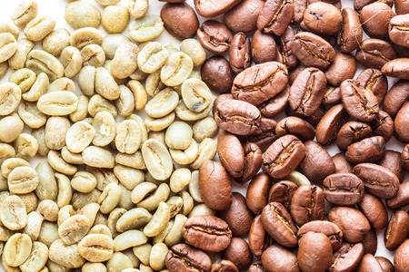 Black and green coffee beans as a background. Various types of coffeeの写真素材