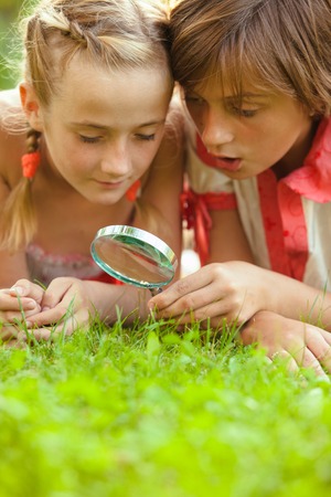 Kid with magnifying glassの写真素材