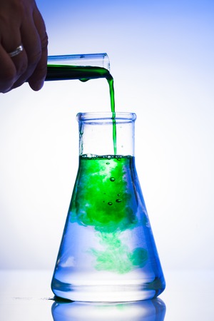 Diffusion in a flask isolated on whiteの写真素材