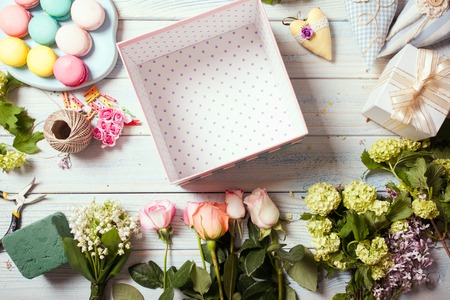 Box with flowers and macaroonsの写真素材