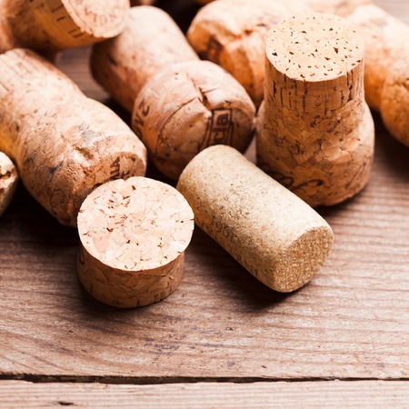 Corks on the wooden table. Wine and alcohol concept