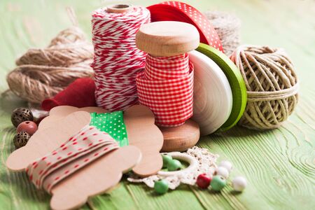 Holiday rope and ribbon decorations for craft paper gift box
