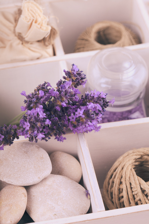 Lavender spa with rebbles, candles and white towels in a boxの写真素材