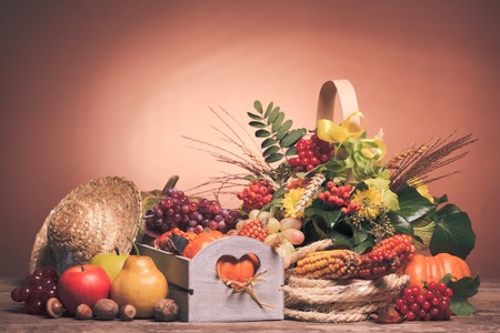 Happy Thanksgiving still life. Fruits, nuts and vegetables, fall crop on  the tableの写真素材