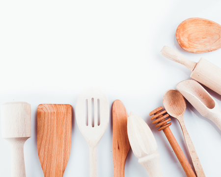 Assortment of wooden kitchen utensils on a white backgroundの写真素材