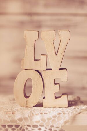 Love wooden letters on the crochet doily, vintage styledの写真素材