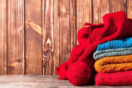 Color threads, knitting needles and clothes with copy spaceの写真素材
