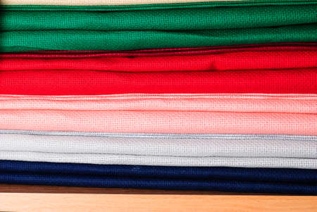 Different colors cross-stitch canvas in craft schop, close upの写真素材