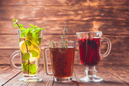 Fragrant herbal tea with thyme, mint, cranberry, lemon for healthy in winterの写真素材