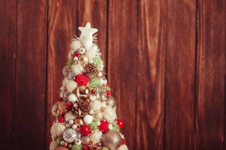 Handmade Christmas tree over wooden background, copy spaceの写真素材