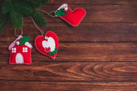 felt Christmas decorations on the wooden table with copy spaceの写真素材
