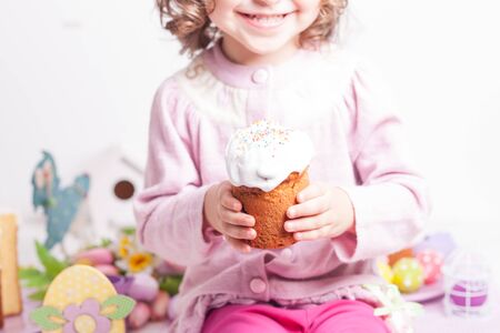 Kid with easter cake want to eat it
