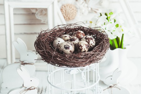Easter decorations - shabby chic white rabbits and wreathの写真素材
