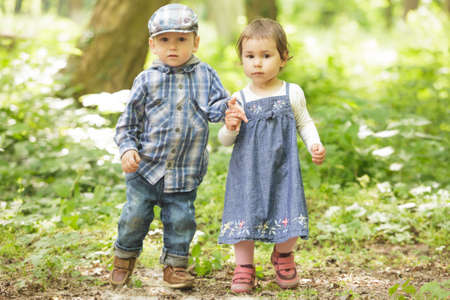 Boy and girl are playing in the park