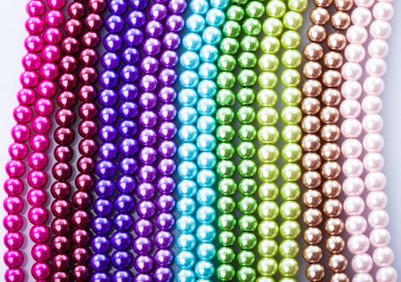 Different colors of beads necklace closeup backgroundの写真素材