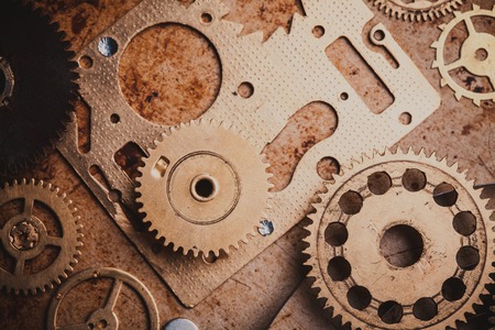 Steampunk background from mechanical clocks details over old metal background. Inside the clock, gearsの写真素材