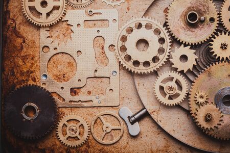 Steampunk background from mechanical clocks details over old metal background. Inside the clock, gearsの写真素材