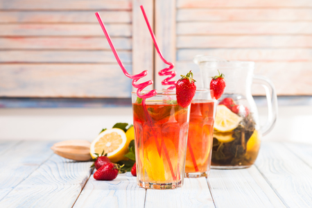 Lemonade with a strawberry, lemon and mintの写真素材