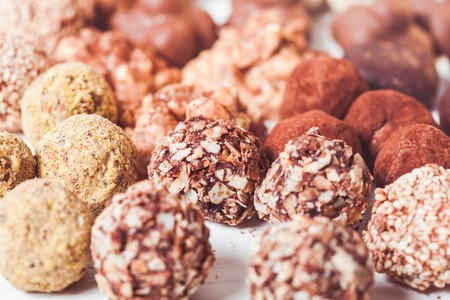 Assorted Chocolate candies on the white table. Luxury handmade sweetsの写真素材