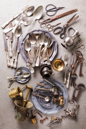 Rarity collectible goods - old cutlery, scissors, keys of different shapes and sizes, old mortar with pestle.の写真素材