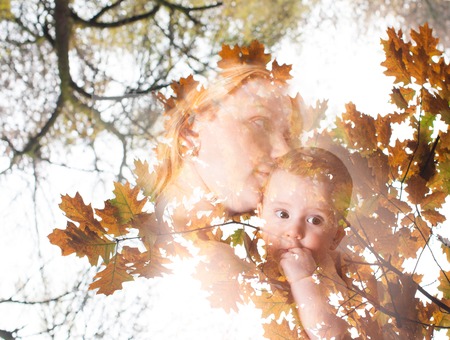 Double exposure. Concept of fall crop and mathernity. Mother with her baby. Love and tenderness