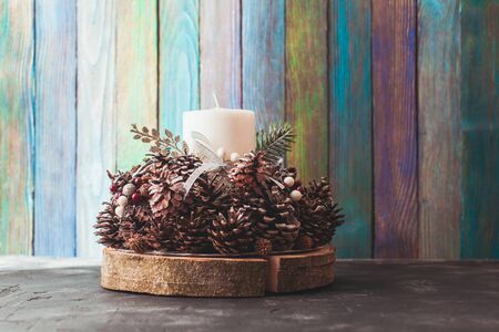 Christmas candlestick on the table, decoration with conesの写真素材