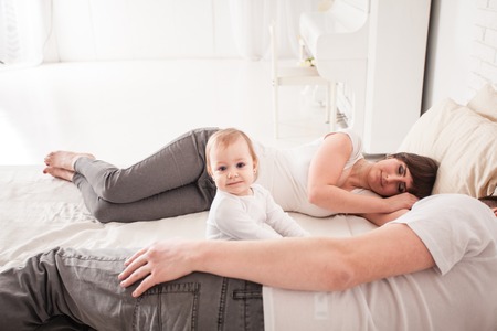 Tired and sleepy parentsの写真素材