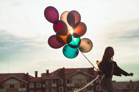 Girl with colorful balloonsの写真素材