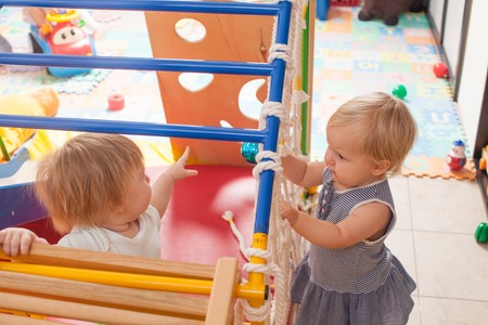 The baby playing on the playgroundの写真素材