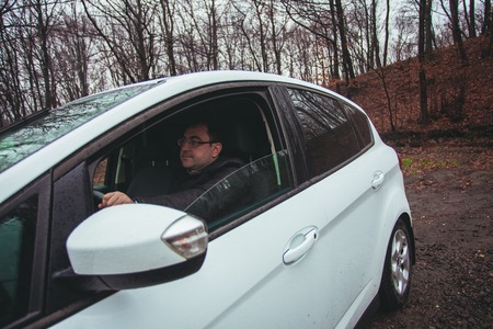 Trip by car in the autumn rainy dayの写真素材