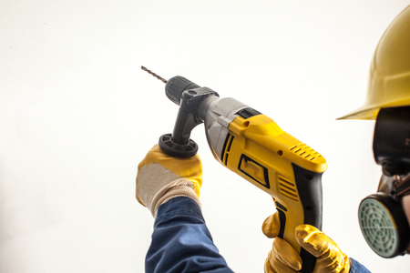 Female worker drillsの写真素材