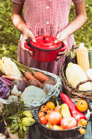 Lovely girl plays with vegetablesの写真素材