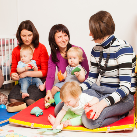 Group of mothers with their babiesの写真素材