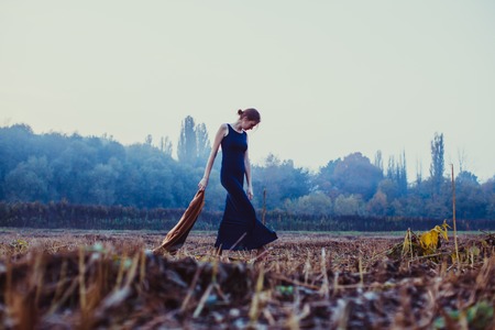 Lonely girl on a walkの写真素材